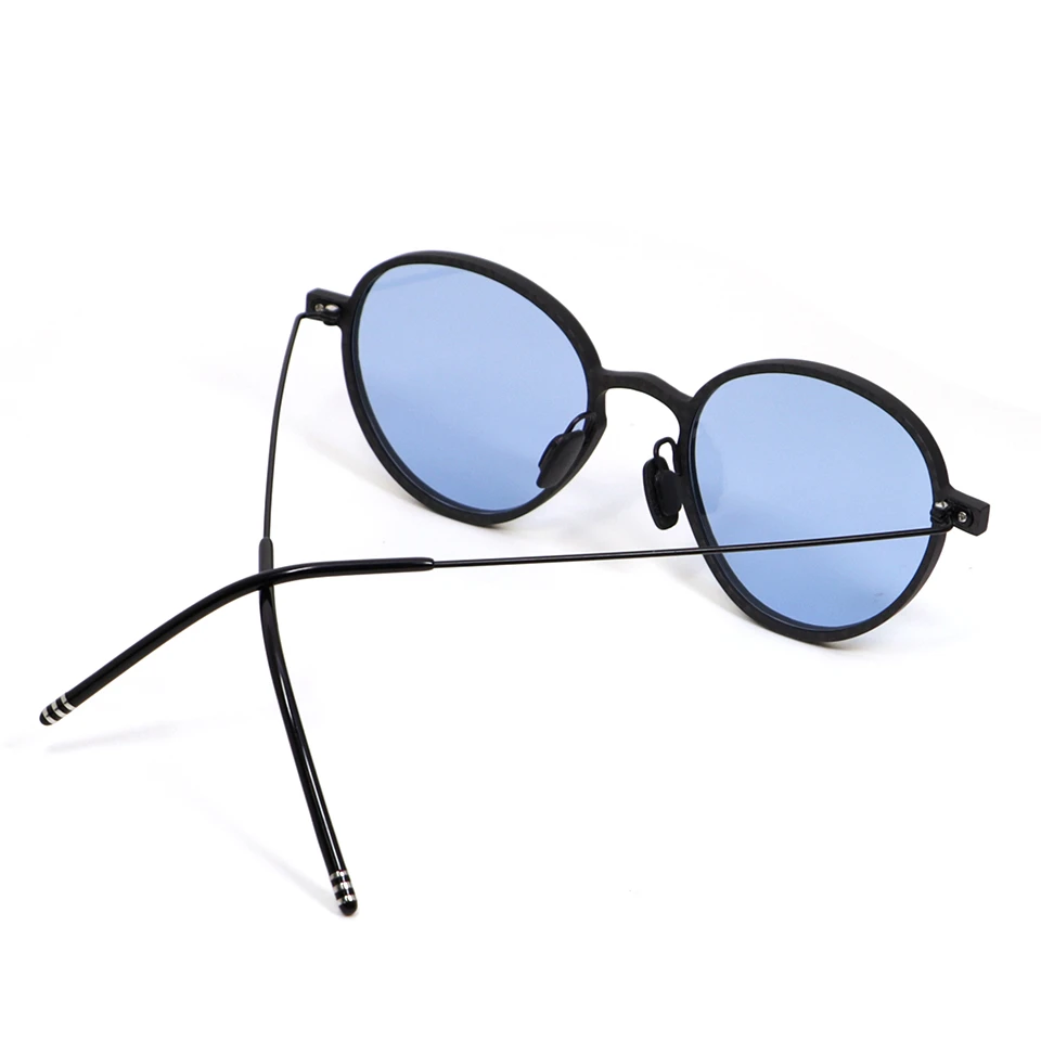 OEM carbon fiber sunglasses with metal temples, side three-quarter view OEM carbon fiber sunglasses with metal temples, side three-quarter view